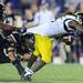 Michigan junior quarterback Denard Robinson attempts to run the ball around Northwestern senior Niko Mafuli during the fourth quarter at Northwestern at Ryan Field on Saturday. Michigan beat Northwestern 42-24. Melanie Maxwell I AnnArbro.com